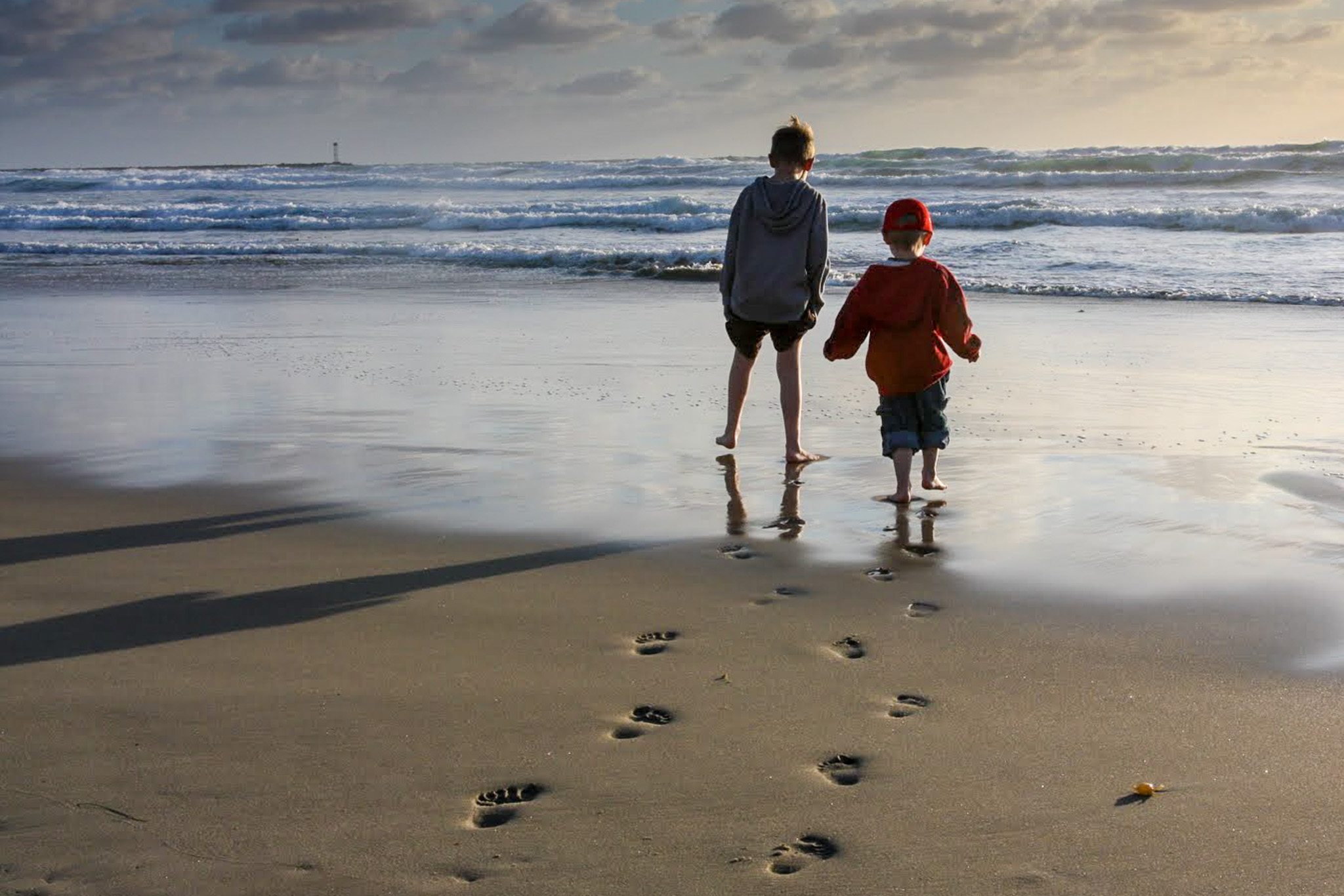 Footprints in the sand. Kids at the beach. San Diego, California