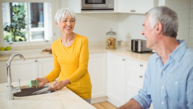 Couple washing dishes